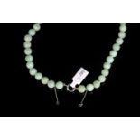 Jade bead necklace, approximately 89jadeite jade beads, 9mm each, strung knotted, rose gold clasp,