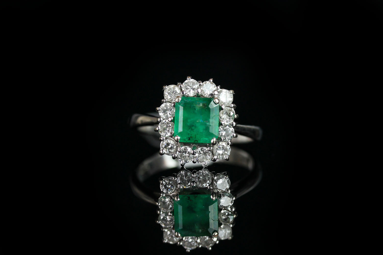 18CT WHITE GOLD EMERALD AND DIAMOND CLUSTER RING, emerald estimated 6.3x 6.4mm, hallmarked , ring