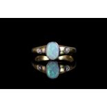 18CT OPAL AND DIAMOND RING, centre stone estimated 8x5mm, total weight 3.9 gms, size M.