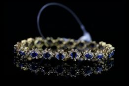 STUNNING 18K SAPPHIRE AND DIAMOND BRACELET, formed 21 clusters, each cluster is formed from a