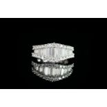Diamond cluster ring, set with 17 baguette cut diamonds, surrounded by 30 round brilliant cut