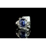 Natural intense blue sapphire and diamond ring, central 3.34ct oval cut blue sapphire accompanied by