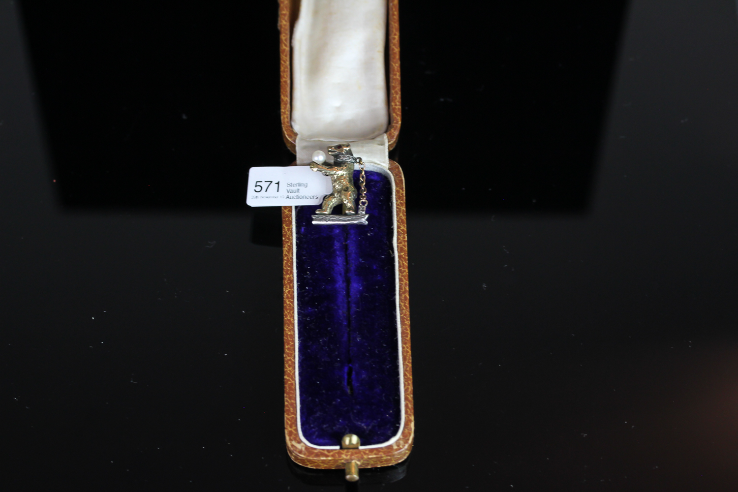 Rare bear stick pin, 23x11mm gold bear with fur detail, ruby set eye, holding a pearl, diamond set