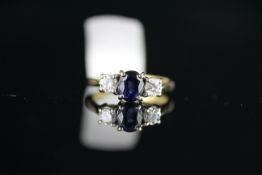 18CT SAPPHIRE AND DIAMOND 3 STONE RING,sapphire estimated 6.2x4.8x3.45mm,each side is a diamond