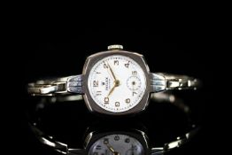 LADIES 9CT VINTAGE ROLEX PRECISION, square, white dial with gold hands, gold arabic markers,20mm