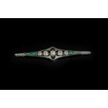 Art Deco Diamond and Emerald bar brooch, five feature old cut diamonds across the centre,