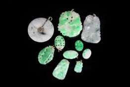 A collection of Jade pieces (10pc) including, large jadeite Jade carved pendant with a white gold