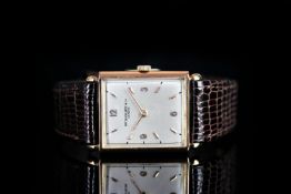 GENTLEMANS VINTAGE 18K ROSE GOLD PATEK PHILIPPE, oblong, silver dial with gold hands, gold baton and