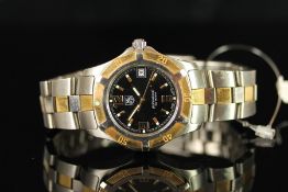 GENTLEMENS TAG HEUER PROFESSIONAL DATE WRISTWATCH REF. WN1154, circular black dial with gold hour