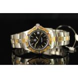 GENTLEMENS TAG HEUER PROFESSIONAL DATE WRISTWATCH REF. WN1154, circular black dial with gold hour