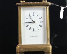 TIFFANY & CO CLOCK, white dial with roman numerals and gun metal blue hands, brass case with glass