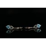 10ct White Gold Topaz and Diamond earrings featuring, 2 trilliant cut, swiss blue Topaz, with 2