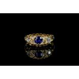 George V, Sapphire and Diamond carved half hoop ring, central 4.4mm blue sapphire, with old cut