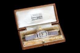 LADIES GOLDSMITHS & SILVERSMITHS CO PLATINUM DIAMOND COCKTAIL WATCH W/ BOX, rounded rectangular