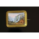 15CT SWISS PORTRAIT BROOCH DEPICTING A WATERFALL AND COTTAGE, total weight 15.40 gms.