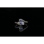 14ct White Gold Sapphire and Diamond ring featuring centre, oval cut, light blue Sapphire (0.