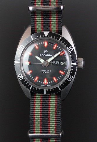 VINTAGE RODANIA AUTOMATIC DIVE WATCH, circular black dial with red and lime hour markers, day and - Image 2 of 3