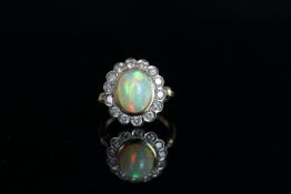 18CT OPAL AND DIAMOND CLUSTER,centre stone estimated as 12.3 x 9.3 mm, diamonds estimated as total