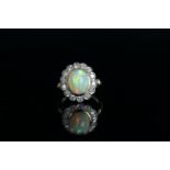 18CT OPAL AND DIAMOND CLUSTER,centre stone estimated as 12.3 x 9.3 mm, diamonds estimated as total