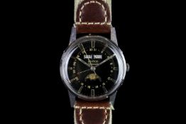 GENTLEMANS ZODIAC,round, black dial with illuminated hands, gold baton markers,day-date at 12 o