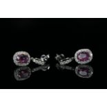 14ct White Gold Sapphire and Diamond drop earrings featuring, 2 oval cut, pink Sapphires (2.23ct