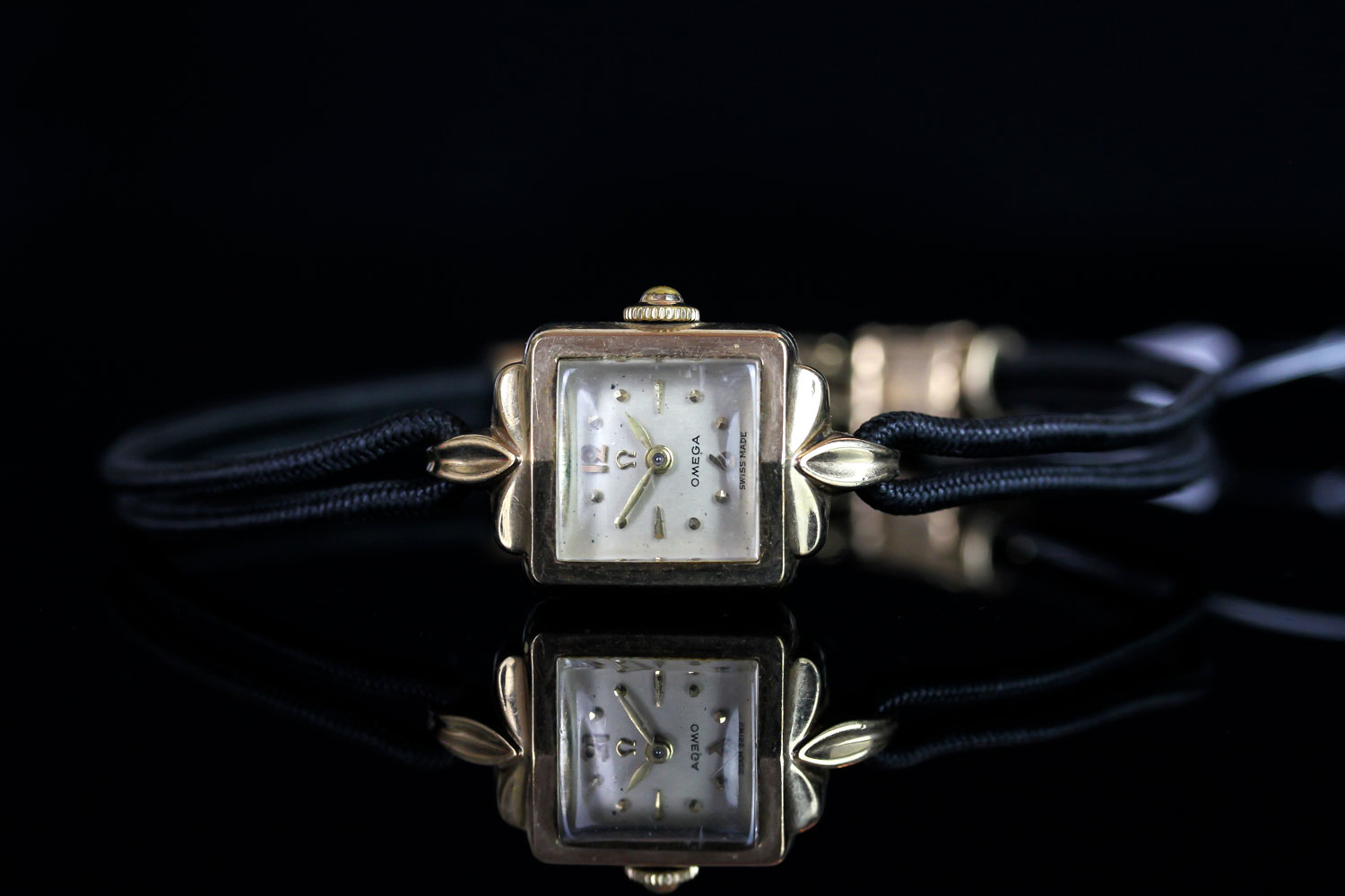 LADIES' OMEGA GOLD COCKTAIL WATCH, square off white dial with gold hour markers and gold hands, 16mm