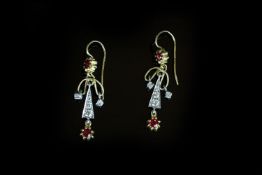 Ruby and diamond drop earrings, round cut ruby suspended from a diamond set triangle, floating
