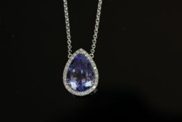 18ct White Gold Tanzanite and Diamond necklace/pendant featuring centre, pear cut, violet blue