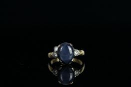 18CT STAR SAPPHIRE AND DIAMOND RING,centre stone estimated at 7ct, 2x diamonds estimated at 0.20ct