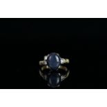 18CT STAR SAPPHIRE AND DIAMOND RING,centre stone estimated at 7ct, 2x diamonds estimated at 0.20ct