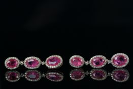 14ct Rose Gold Ruby and Diamond drop earrings featuring, 6 oval cut, natural Rubies (5.72ct TSW),