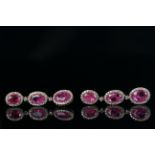 14ct Rose Gold Ruby and Diamond drop earrings featuring, 6 oval cut, natural Rubies (5.72ct TSW),