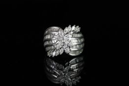 STUNNING PLATINUM AND DIAMOND COCKTAIL RING, with marquise,baquette and brilliant cut stones,