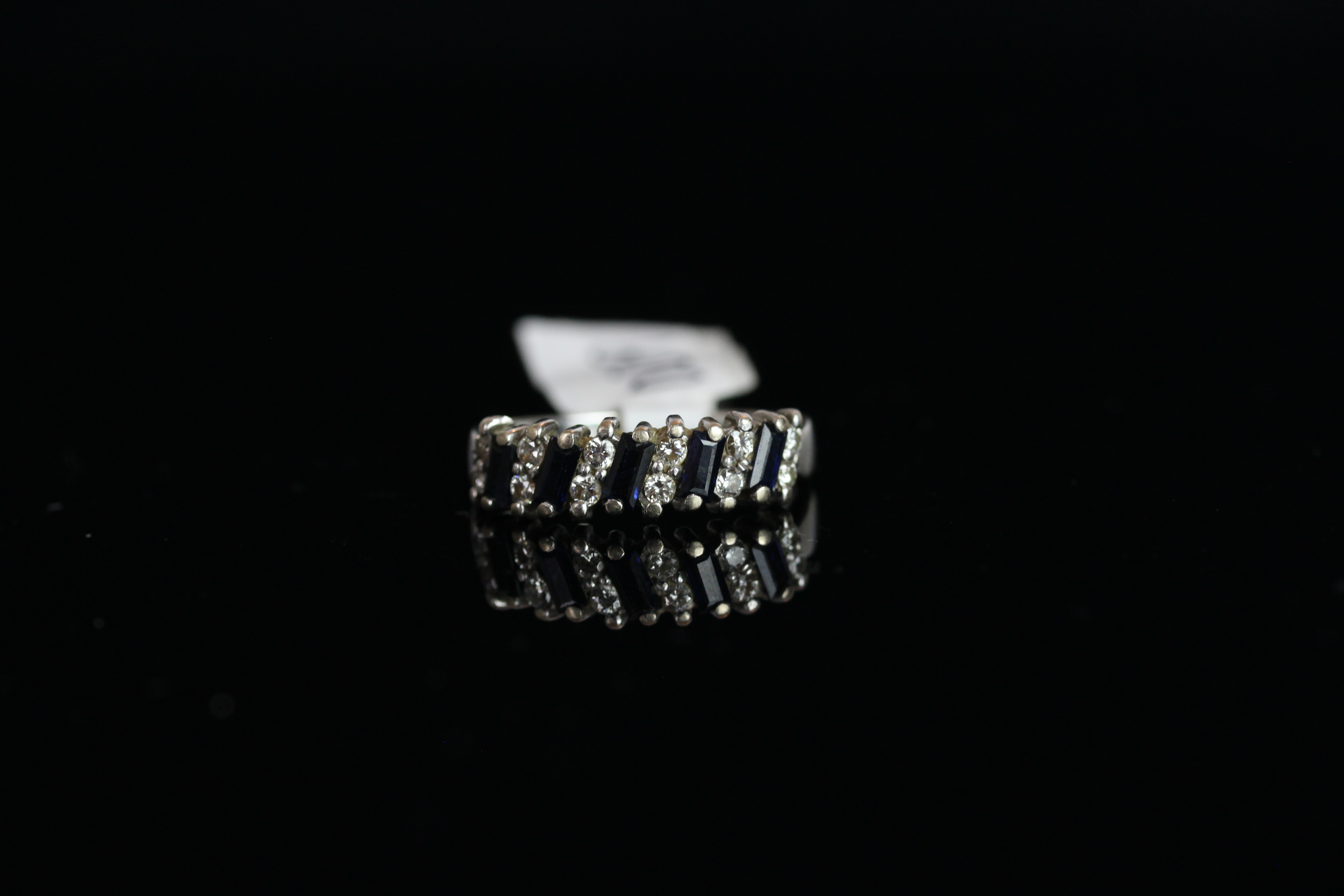 18CT WHITE GOLD SAPPHIRE AND DIAMOND HALF ETERNITY RING,hallmarked, total weight 3.94 gms.ring