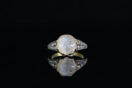 18CT MOONSTONE RING, centre stone 5mm, stone set shoulders, total weight 4.5gms, size N.
