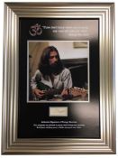 George Harrison, Vintage cut page baring the autograph of George Harrison. Professionally framed