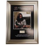 George Harrison, Vintage cut page baring the autograph of George Harrison. Professionally framed