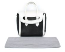Alexander McQueen tote bag black and white calf skin, with silver studs at the bottom, includes dust