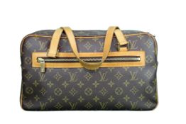 Louis Vuitton Cite GM bag in the classic monogram canvas with leather trim and gold tone hardware,