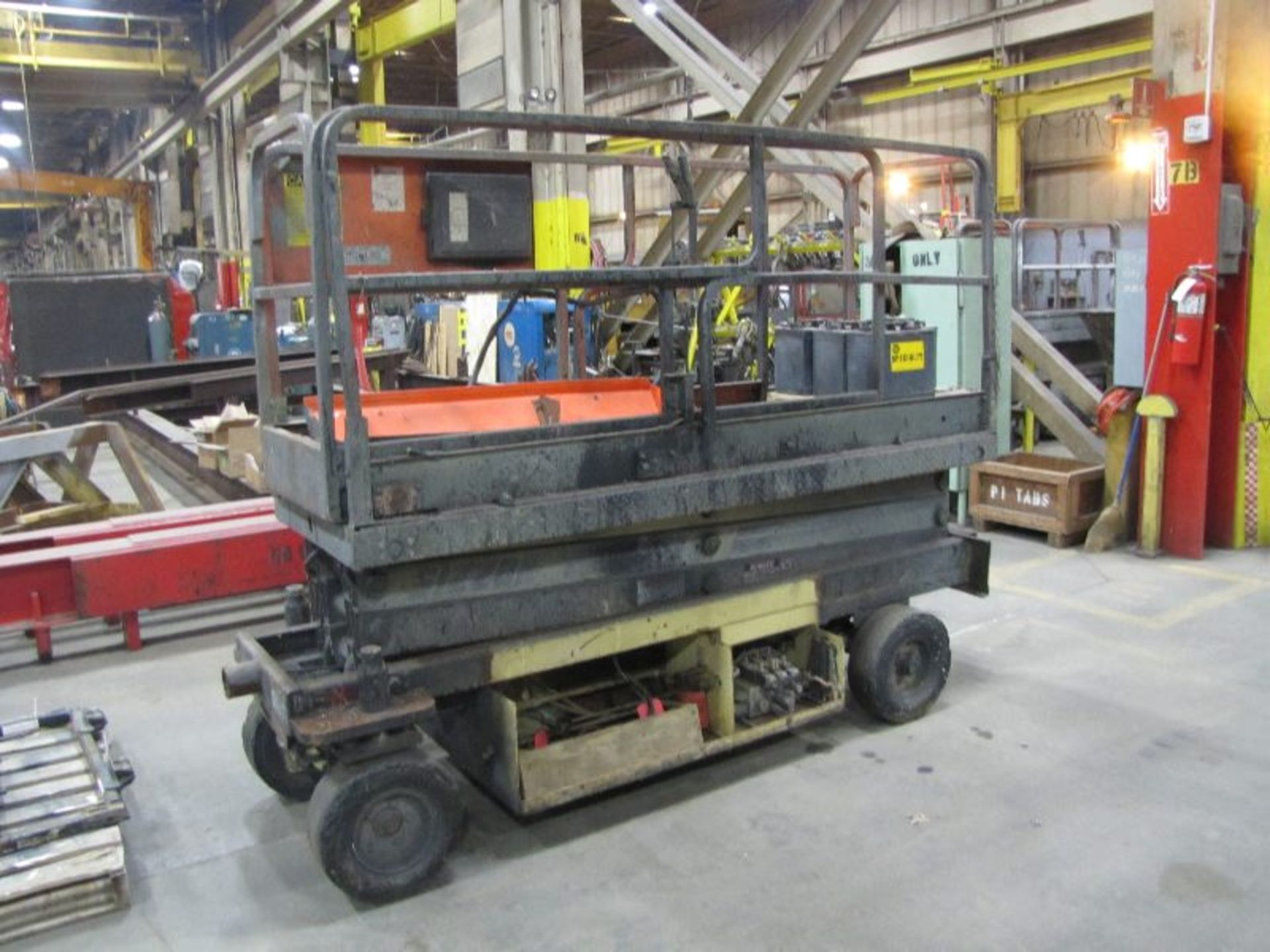 JLG Model CM2033 Sizzor Lift, Platform, Battery Type, 24 Volts DC Motor