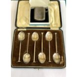 Boxed set of silver spoons and a silver vesta match striker