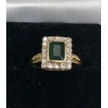 18ct gold emerald and diamond ring weight of ring 5.2g set with central emerald that measures approx