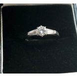 18ct white gold diamond ring set with central diamond with baguette diamond either side hallmarked