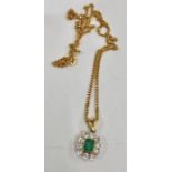 18ct gold emerald and diamond pendant on chain pendant measures approx 20mm by 10mm set with central