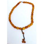 Egg yolk amber bead necklace mainly graduated even sized beads largest bead measures approx 16mm wid