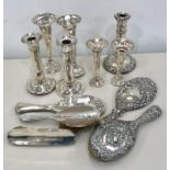 Collection of silver items includes brush sets flower vases candlesticks etc
