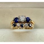 Fine 14ct gold diamond and sapphire ring set with large diamond with diamond and sapphires around c