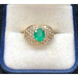 Fine 18ct gold emerald and diamond ring set with large central emerald