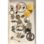 Collection of antique and vintage silver jewellery includes brooches ,silver medals ,rings .locket e