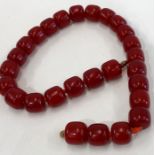 Cherry amber / Bakelite bead necklace barrel shaped beads with good internal streaking